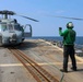 AEAN Bruce Wade directs MH-60R Seahawk pilots during COMPTUEX flight operations