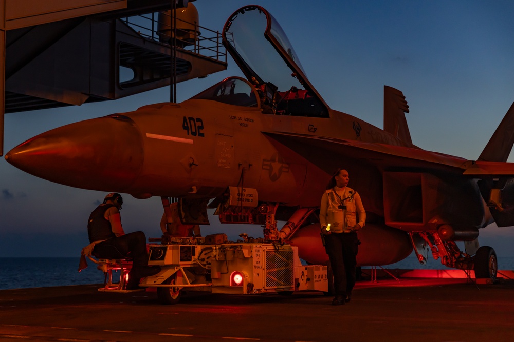 Sailors Transport Aircraft from the Flight Deck to the Hangar Bay on USS Gerald R. Ford (CVN 78)