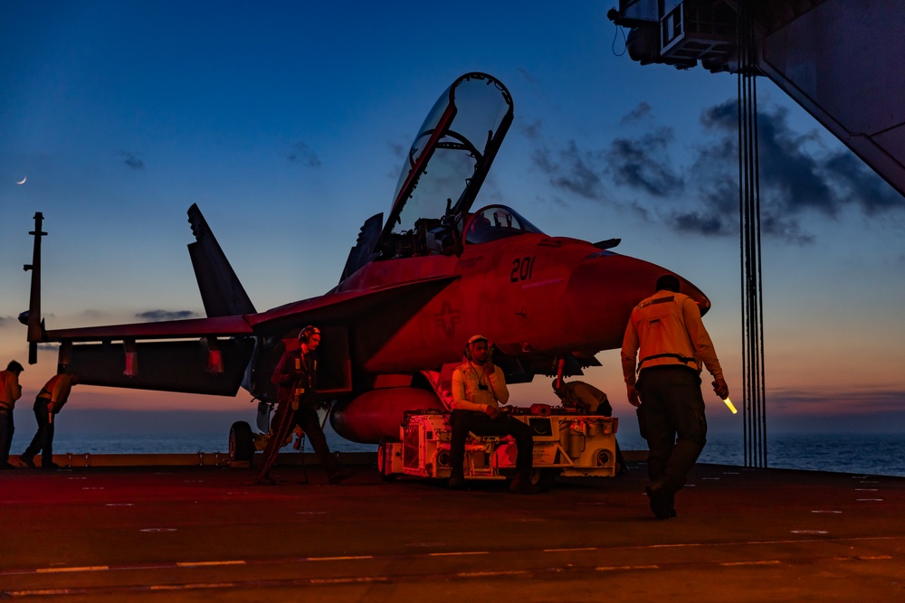 Sailors Transport Aircraft from the Flight Deck to the Hangar Bay on USS Gerald R. Ford (CVN 78)