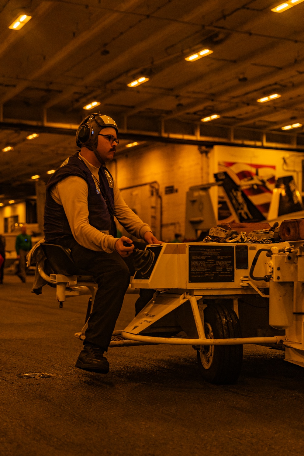 Sailors Transport Aircraft from the Flight Deck to the Hangar Bay on USS Gerald R. Ford (CVN 78)