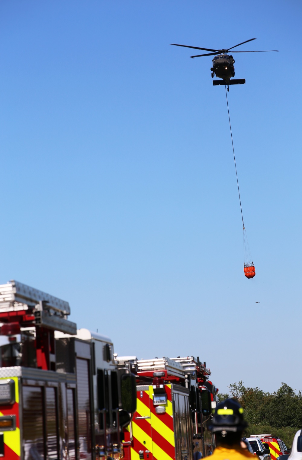 Army National Guard and Central Pierce Fire Department Conduct Water Bucket Training