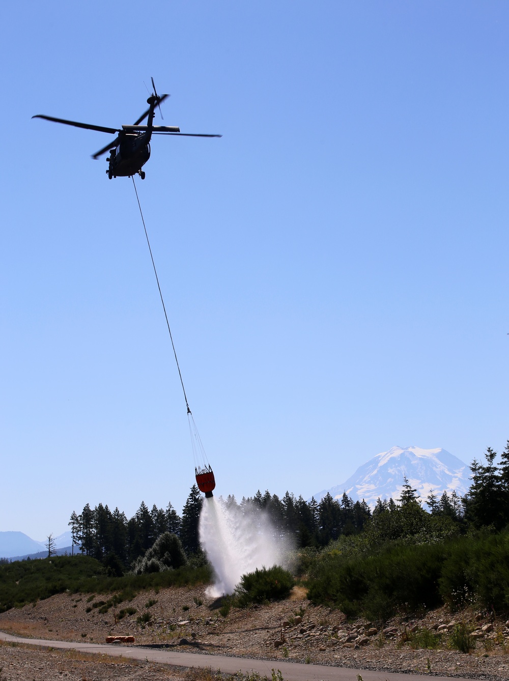 Army National Guard and Central Pierce Fire Department Conduct Water Bucket Training