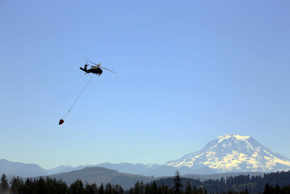 Army National Guard and Central Pierce Fire Department Conduct Water Bucket Training