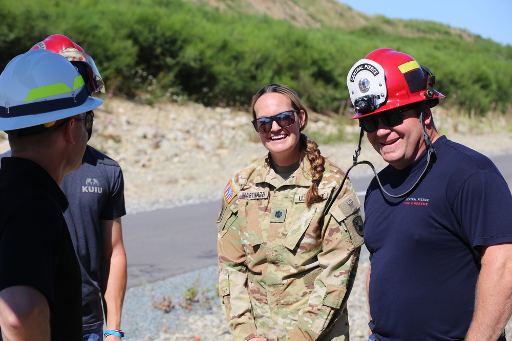 Army National Guard and Central Pierce Fire Department Conduct Water Bucket Training