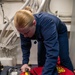 USS Gerald R. Ford (CVN 78) Sailor Stows Firefighting Equipment