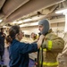 USS Gerald R. Ford (CVN 78) Sailor Dons Firefighting Equipment