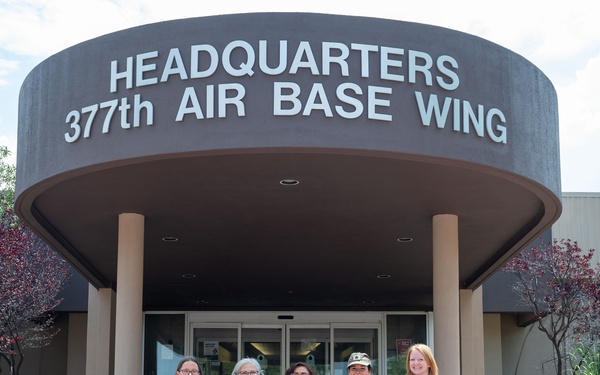 Mrs. Christine Grady Poses with Members of Team Kirtland