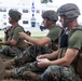U.S. Marines with MWSS-273 conduct simulated tactical combat casualty care