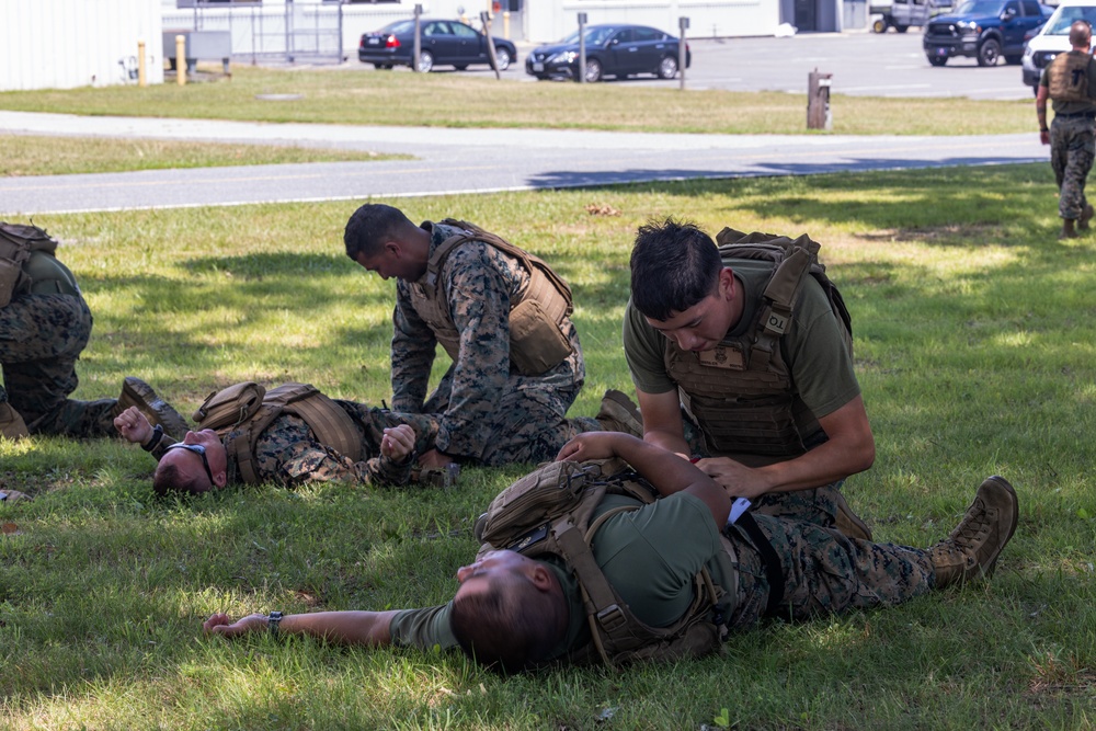 U.S. Marines with MWSS-273 conduct simulated tactical combat casualty care