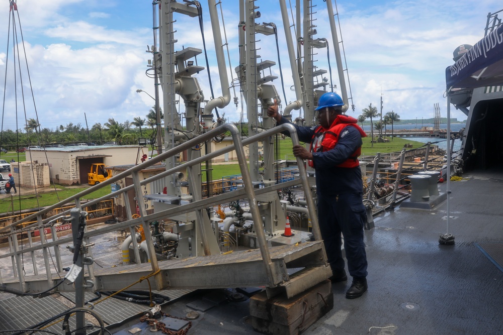 Sailors aboard the USS John Finn conduct a sea and anchor detail in Apra Harbor, Guam