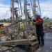 Sailors aboard the USS John Finn conduct a sea and anchor detail in Apra Harbor, Guam