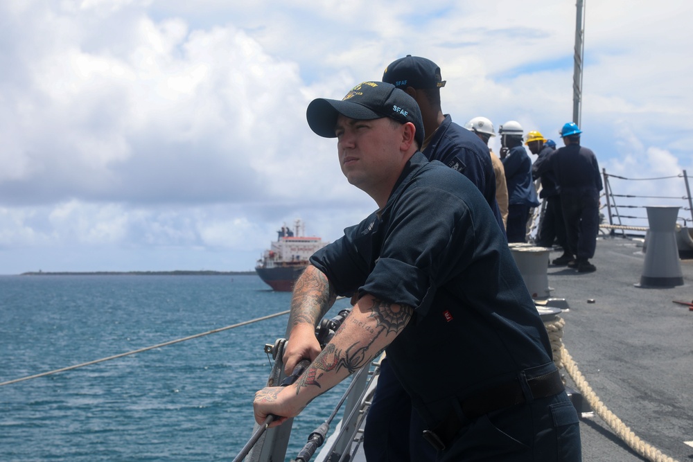 Sailors aboard the USS John Finn conduct a sea and anchor detail in Apra Harbor, Guam