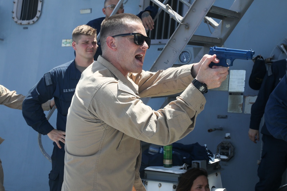 Sailors aboard the USS John Finn hold a security reaction force class in the Philippine Sea