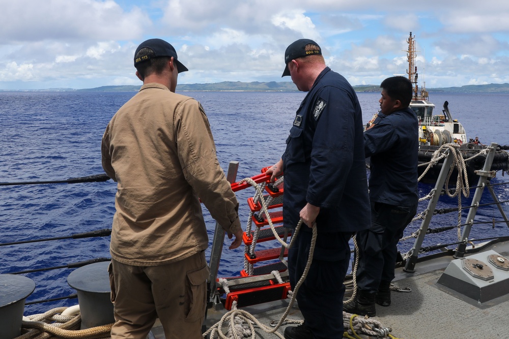 Sailors aboard the USS John Finn conduct a passenger transfer in the Philippine Sea