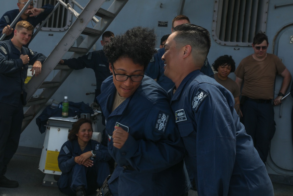 Sailors aboard the USS John Finn hold a security reaction force class in the Philippine Sea