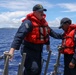 Sailors aboard the USS John Finn conduct a passenger transfer in the Philippine Sea