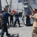 Sailors aboard the USS John Finn hold a security reaction force class in the Philippine Sea