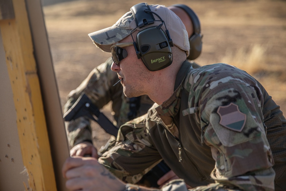 Coalition Members Conduct Weapons Training at Beneslawa Range