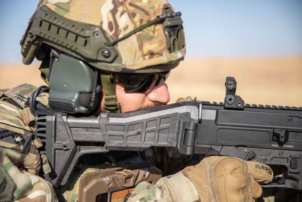 Coalition Members Conduct Weapons Training at Beneslawa Range