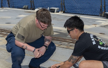 Tactical Combat Casualty Care drill on USS Paul Ignatius