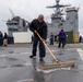 USS PEARL HARBOR (LSD 52) Sailors man the rails as the ship departs for Pacific Partnership 2025