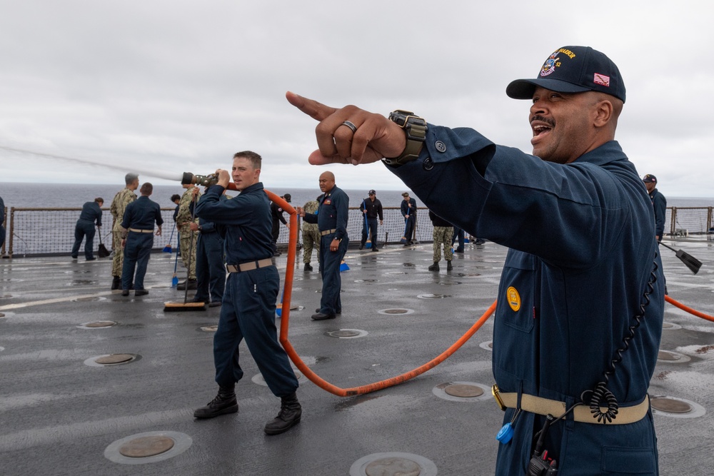 USS PEARL HARBOR (LSD 52) Sailors man the rails as the ship departs for Pacific Partnership 2025