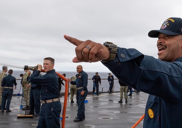 USS PEARL HARBOR (LSD 52) Sailors man the rails as the ship departs for Pacific Partnership 2025
