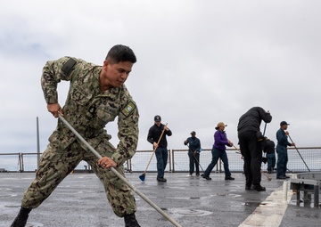 USS PEARL HARBOR (LSD 52) Sailors man the rails as the ship departs for Pacific Partnership 2025