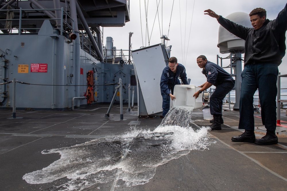 USS PEARL HARBOR (LSD 52) Sailors man the rails as the ship departs for Pacific Partnership 2025