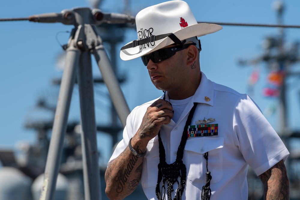 USS PEARL HARBOR (LSD 52) Sailors man the rails as the ship departs for Pacific Partnership 2025