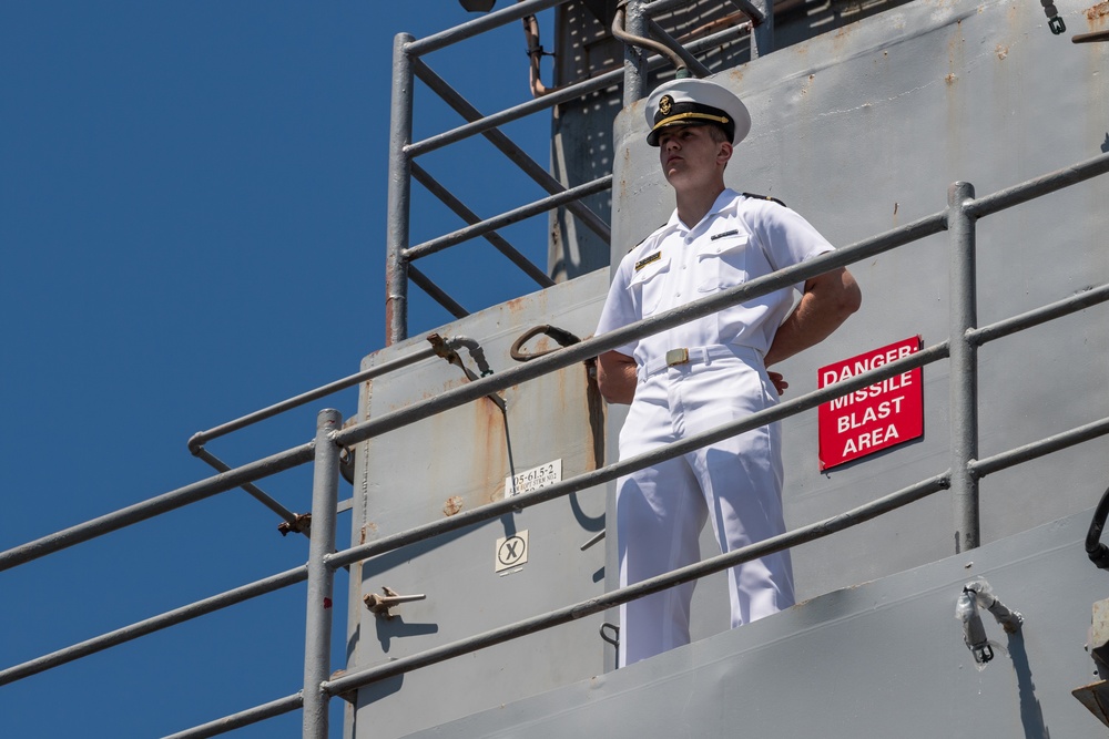 USS PEARL HARBOR (LSD 52) Sailors man the rails as the ship departs for Pacific Partnership 2025