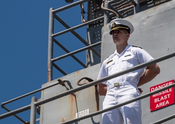 USS PEARL HARBOR (LSD 52) Sailors man the rails as the ship departs for Pacific Partnership 2025