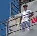 USS PEARL HARBOR (LSD 52) Sailors man the rails as the ship departs for Pacific Partnership 2025