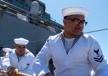 USS PEARL HARBOR (LSD 52) Sailors man the rails as the ship departs for Pacific Partnership 2025