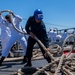 USS PEARL HARBOR (LSD 52) Sailors man the rails as the ship departs for Pacific Partnership 2025
