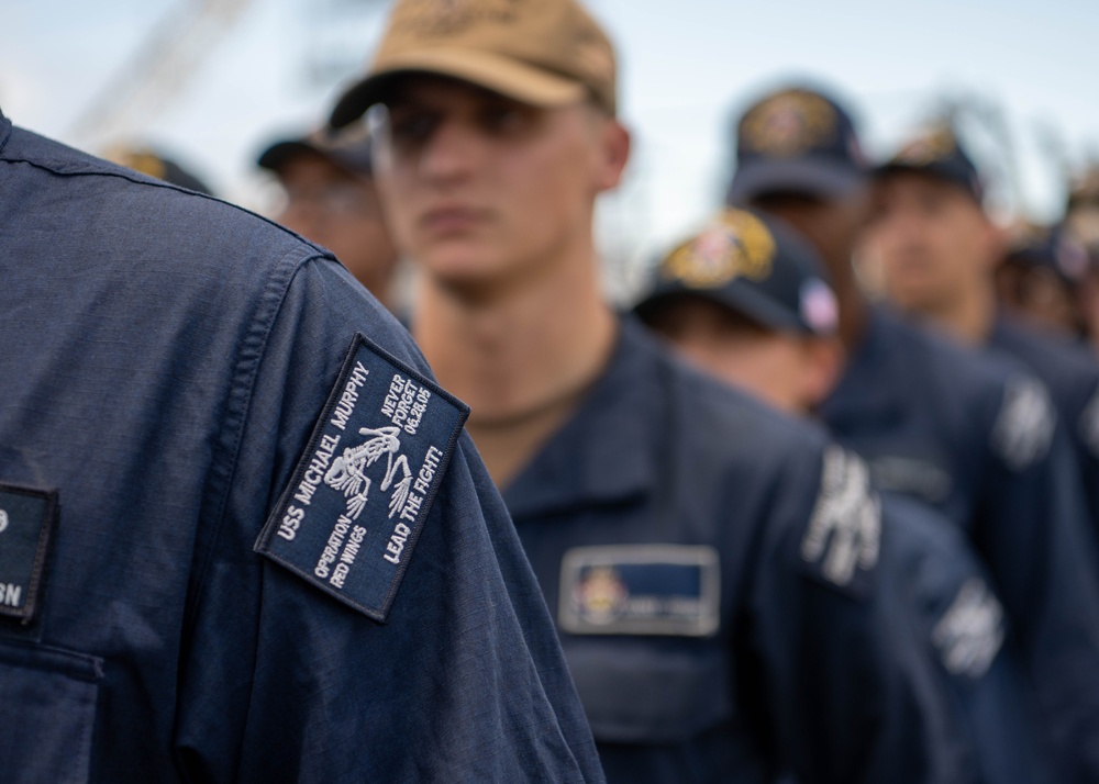 Adm. Steve Koehler, commander, U.S. Pacific Fleet, presents the Arleigh Burke Trophy Award to USS Michael Murphy
