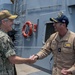 Adm. Steve Koehler, commander, U.S. Pacific Fleet, presents the Arleigh Burke Trophy Award to USS Michael Murphy