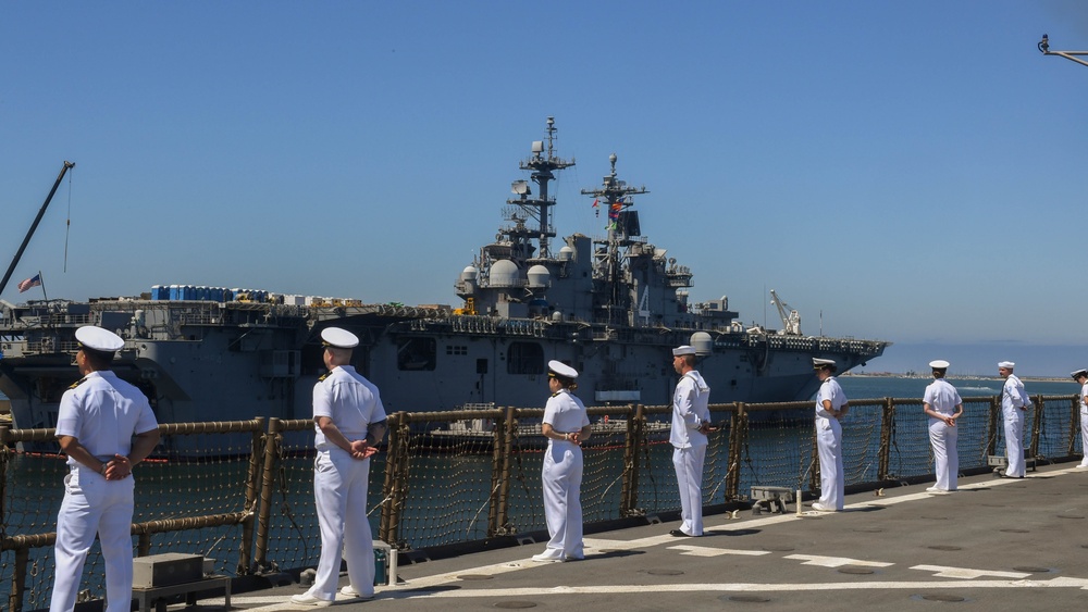 USS PEARL HARBOR (LSD 52) Sailors man the rails as the ship departs for Pacific Partnership 2025
