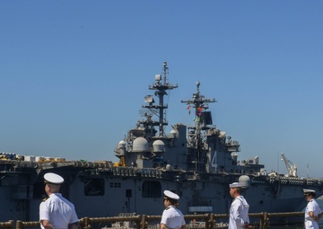 USS PEARL HARBOR (LSD 52) Sailors man the rails as the ship departs for Pacific Partnership 2025