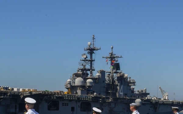 USS PEARL HARBOR (LSD 52) Sailors man the rails as the ship departs for Pacific Partnership 2025