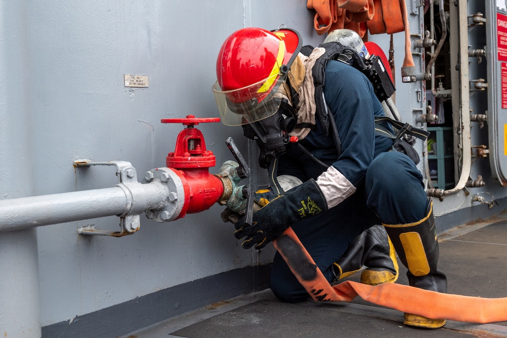 USS PEARL HARBOR (LSD 52) Sailors perform general quarters drill