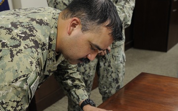 LS1 Flores Reenlists at 22NCR