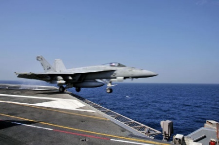 U.S. Navy Fighter Jet Launches from Aircraft Carrier in Persian Gulf to Support Operations in Iraq