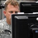 Service Member Monitors Computer During Cyber Guard 2015 Exercise