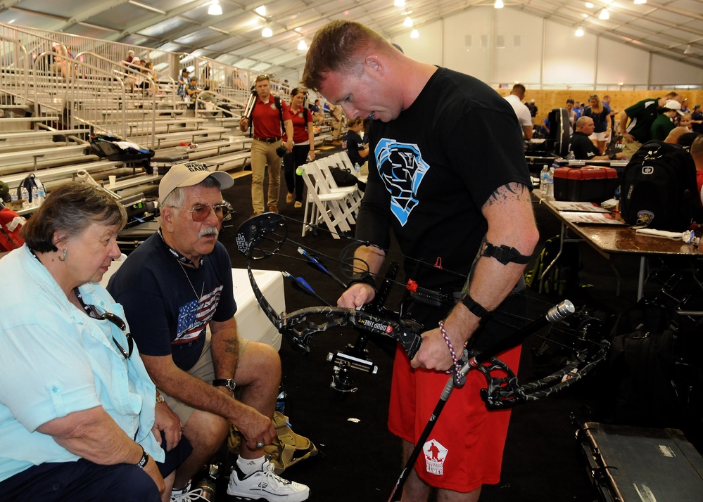 Marine Reservist Shares Archery Skills with Grandparents at Warrior Games