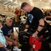 Marine Reservist Shares Archery Skills with Grandparents at Warrior Games