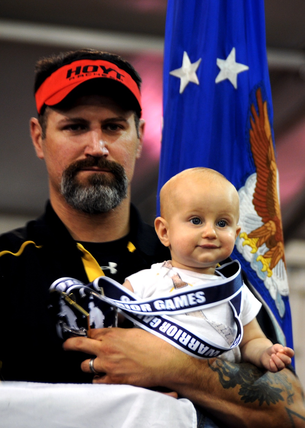 Retired Army Veteran Passes Medal to Son at Warrior Games