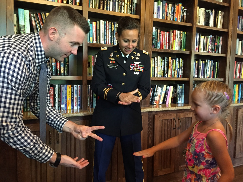 Army Nurse Celebrates Promotion with Daughter and Former Colleague