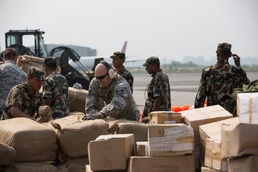 U.S. Airmen, Nepalese Troops Offload Humanitarian Aid After Earthquake