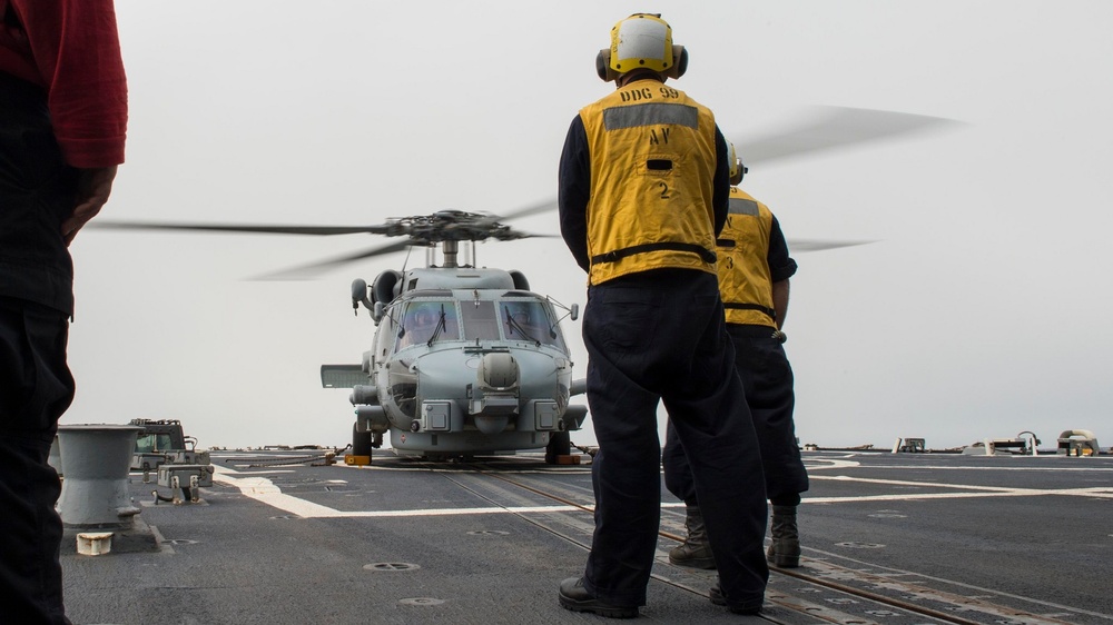 Sailors Prepare to Launch MH-60R Helicopter from USS Farragut in 5th Fleet